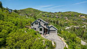 View of front facade with a mountain view and a detached garage