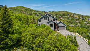 Chalet / cabin featuring a mountain view and a chimney