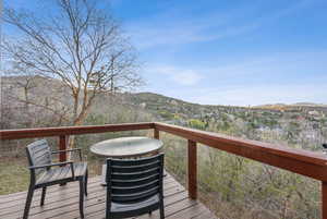 Wooden terrace featuring a mountain view