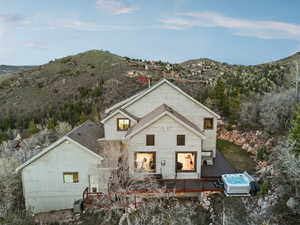 Exterior space featuring a deck with mountain view