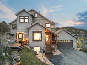 View of front of home with a wooden deck
