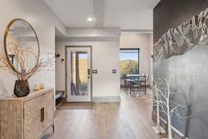 Entrance foyer with baseboards, recessed lighting, and hardwood / wood-style flooring
