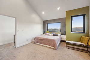 Carpeted bedroom featuring high vaulted ceiling, baseboards, and recessed lighting