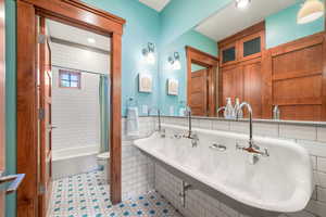 Full bathroom with shower / tub combo with curtain, tile patterned flooring, toilet, and recessed lighting