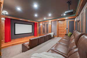 Carpeted home theater featuring recessed lighting and a wall mounted AC