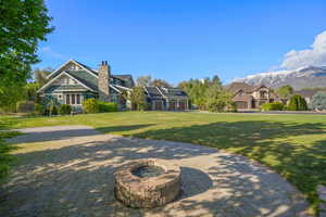 Surrounding community featuring a lawn and a mountain view