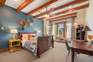 Bedroom featuring carpet, beamed ceiling, baseboards, and recessed lighting