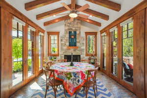 Sunroom featuring french doors and beam ceiling