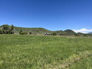 Property view of mountains featuring a rural view