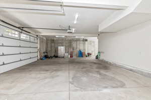 Garage featuring a garage door opener
