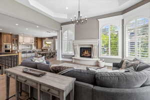 Living area with recessed lighting, a healthy amount of sunlight, and light wood-type flooring