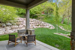 View of yard with a patio