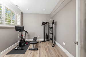 Workout room featuring baseboards, recessed lighting, visible vents, and wood finished floors