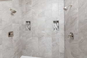 Full bathroom featuring tiled shower