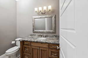 Bathroom featuring toilet and vanity