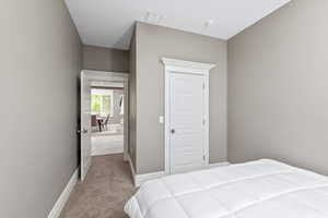 Bedroom featuring visible vents, baseboards, and carpet floors