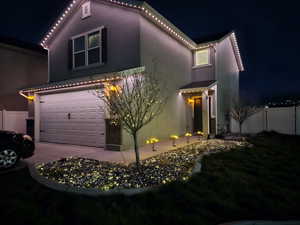 Mediterranean / spanish-style house with concrete driveway, stucco siding, fence, and a garage