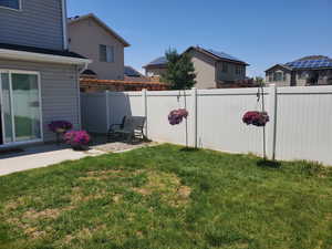 View of yard featuring a patio area and fence