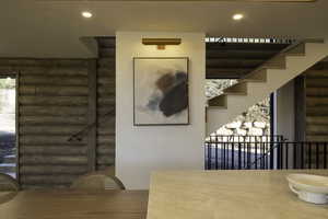 Unfurnished dining area featuring stairs, rustic walls, and recessed lighting