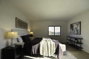 Bedroom with recessed lighting, baseboards, and wood finished floors