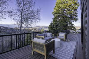 Deck featuring a mountain view and outdoor lounge area