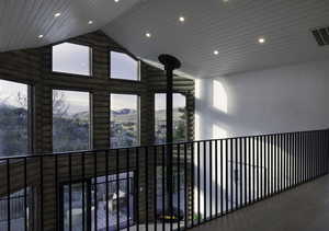 Corridor with recessed lighting, rustic walls, high vaulted ceiling, and wood ceiling