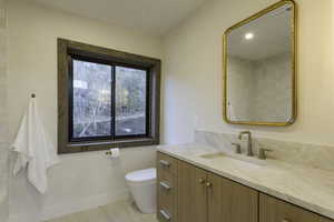 Bathroom featuring toilet and vanity
