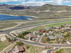 Birds eye view of property featuring a residential view and a water and mountain view