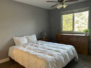 Bedroom with carpet and a ceiling fan