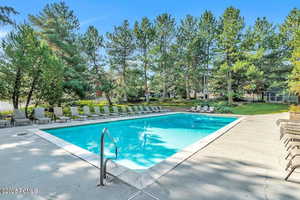 Community pool featuring a patio