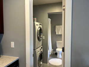 Laundry room with stacked washer / dryer and laundry area