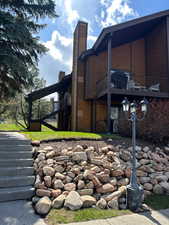 View of home's exterior featuring a chimney