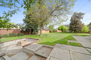 View of yard with a patio and a fenced backyard