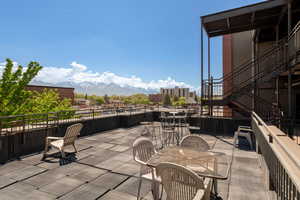 View of patio with outdoor dining space and a mountain view