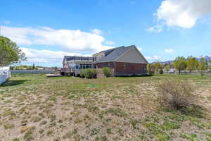Exterior space with a wooden deck and fence
