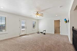 Family room with access to large rooftop deck.