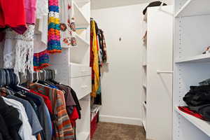 Primary Bedroom Walk in closet  1 of 2  closets