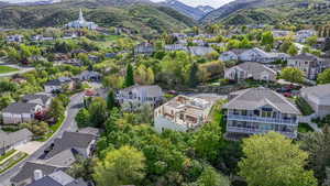 Birds eye view of property featuring a mountain view and a residential view