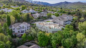 Drone / aerial view with a mountain view and a residential view