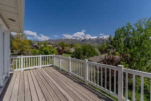 Wooden deck featuring a mountain view
