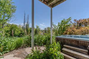 View of patio / terrace featuring a hot tub
