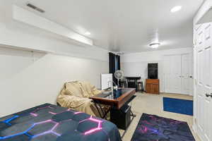 Bedroom featuring carpet, visible vents, and recessed lighting