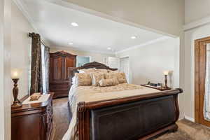 Bedroom featuring ornamental molding, carpet floors, and recessed lighting