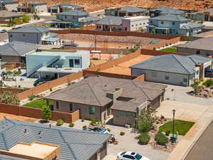 Aerial perspective of suburban area featuring a mountainous background