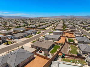 Aerial perspective of suburban area with a mountain backdrop