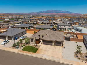 Aerial perspective of suburban area with a mountain backdrop