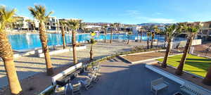 Pool with a residential view