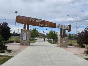 View of home's community with fence