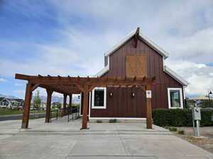 View of community with a pergola and fence