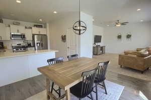 Dining area featuring recessed lighting, a ceiling fan, and wood finished floors